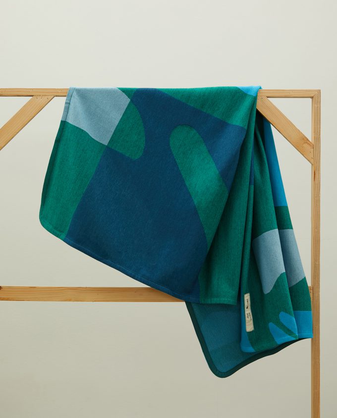 Green flat knit blanket